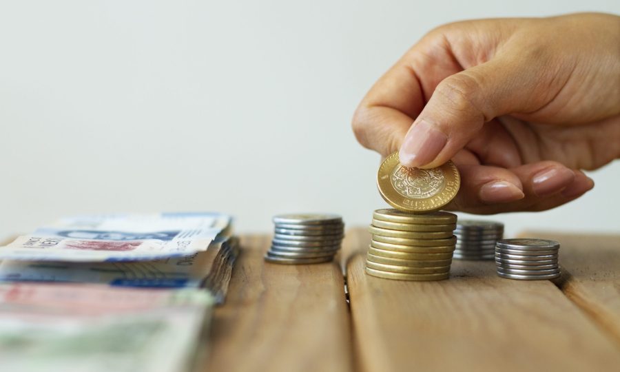 hand-holding-mexican-coin